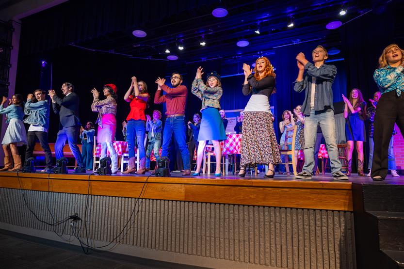 Students perform onstage